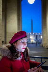 Portrait of young woman in hat