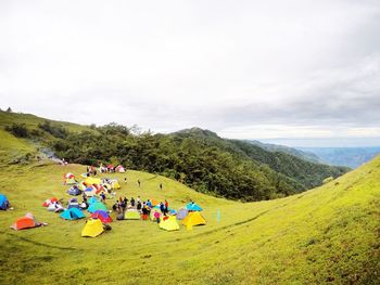 View of people camping on mountain