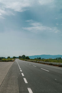 Empty road against sky