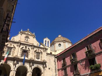 Low angle view of church against blue sky