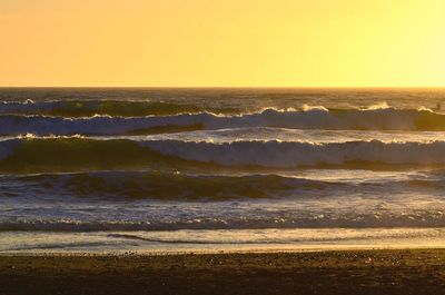 Scenic view of sea at sunset