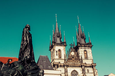 Statue of temple against building