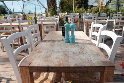 View of blue bottles placed on table in restaurant