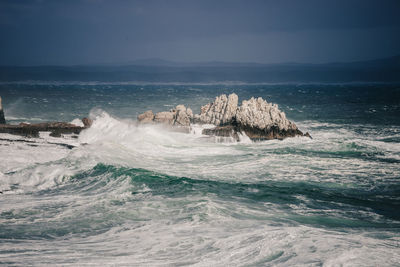 Scenic view of rock formation in sea