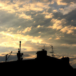 Low angle view of building against cloudy sky