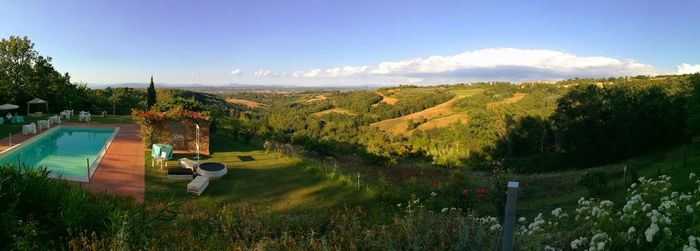 Scenic view of landscape against blue sky