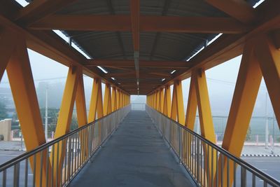 View of footbridge against sky