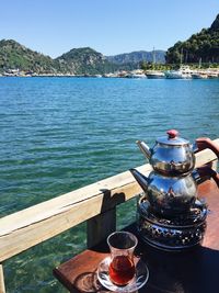 Close-up of tea kettle on boat sailing in sea