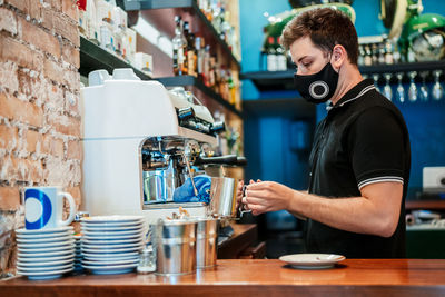 Man working with coffee in cafe