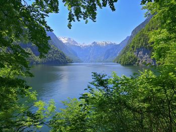 Scenic view of lake and mountains against sky