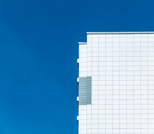 Low angle view of built structure against clear blue sky