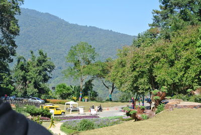 Panoramic view of people on mountains against sky