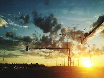 View of street light against cloudy sky