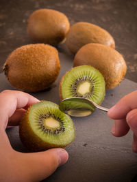 Close-up of hand holding fruits