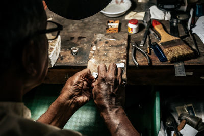 High angle view of man working on table