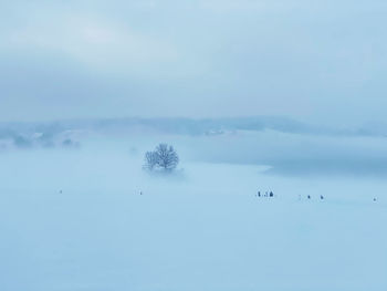 Scenic view of snow covered landscape against sky