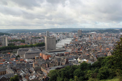 High angle shot of townscape against clouds