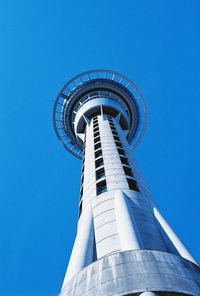 Low angle view of tower against blue sky