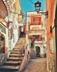 Narrow alley amidst buildings in city