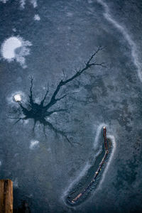 High angle view of people skiing on mountain during winter