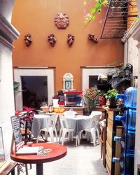 Empty chairs and tables in cafe