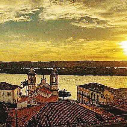 sunset, sky, built structure, architecture, orange color, building exterior, cloud - sky, sea, water, high angle view, railing, yellow, scenics, nature, beauty in nature, sunlight, outdoors, no people, tranquility, roof