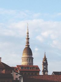 High angle view of church against cloudy sky