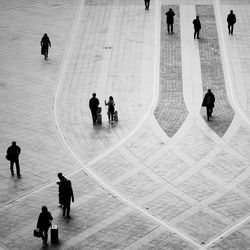 High angle view of people walking in town square