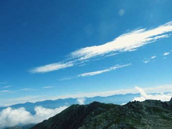 Low angle view of mountain against blue sky