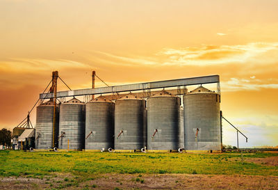 Scenic view of field against sky during sunset