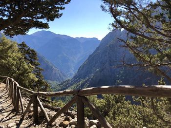 Scenic view of mountains against blue sky