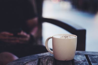 Mug of coffee on a rustic table