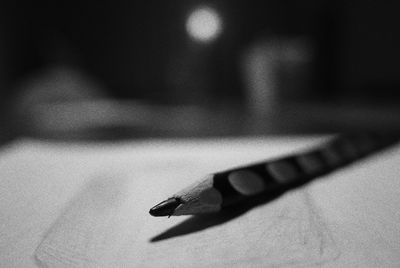 Close-up of pen on table