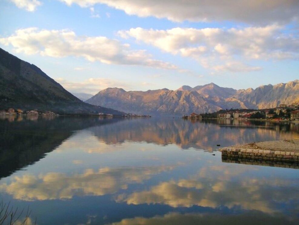 REFLECTION OF MOUNTAINS IN LAKE