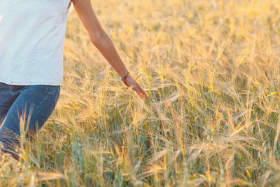 Midsection of man standing on field