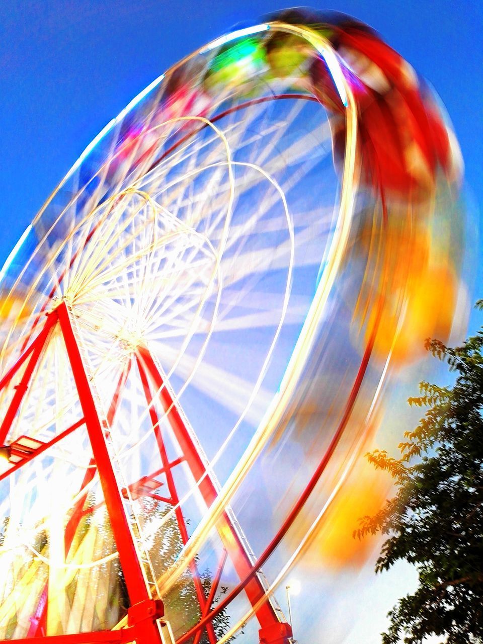 CLOSE-UP OF FERRIS WHEEL AGAINST SKY