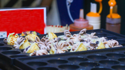 Takoyaki being prepared in ho thi ky street food, ho chi minh city