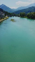 Scenic view of river and mountains