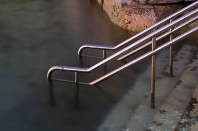 High angle view of empty staircase in lake during winter