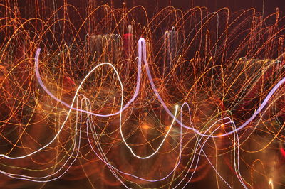 Light trails against sky at night