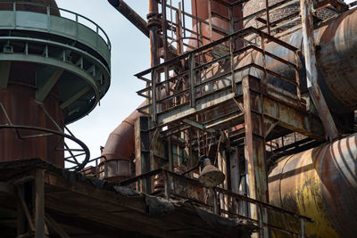 Low angle view of abandoned building against sky