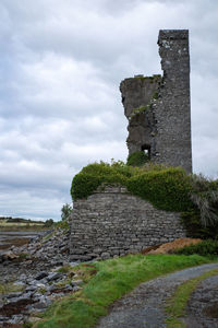 Old ruin building against cloudy sky