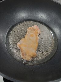 High angle view of meat in cooking pan