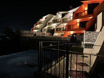 Illuminated modern buildings in city at night