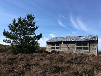 House on field against sky