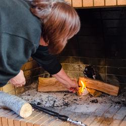 Close-up of woman working in kitchen