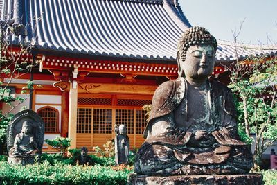 Statue against temple building