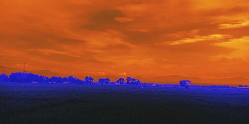 Scenic view of dramatic sky during sunset