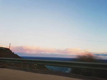 Scenic view of sea against clear sky during sunset