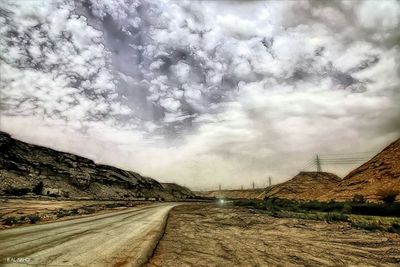 View of road against cloudy sky